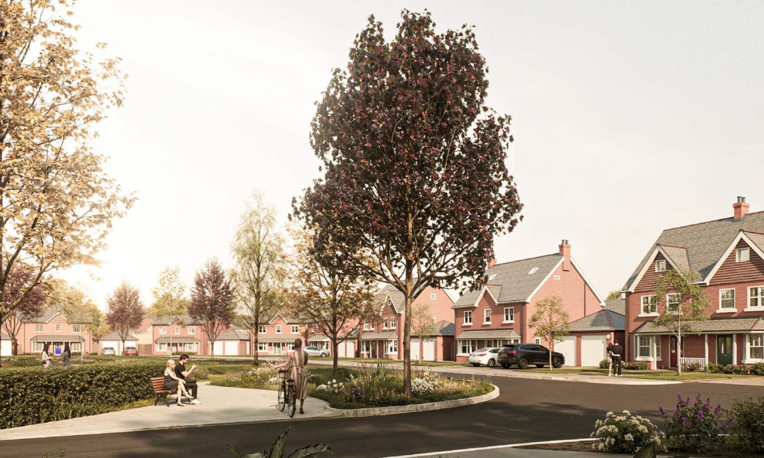 A landscaped street scene at Gleneagles Drive with red-brick family homes, mature trees and planting, and residents relaxing and walking through the central green space – capturing the calm, community-focused character of the development.