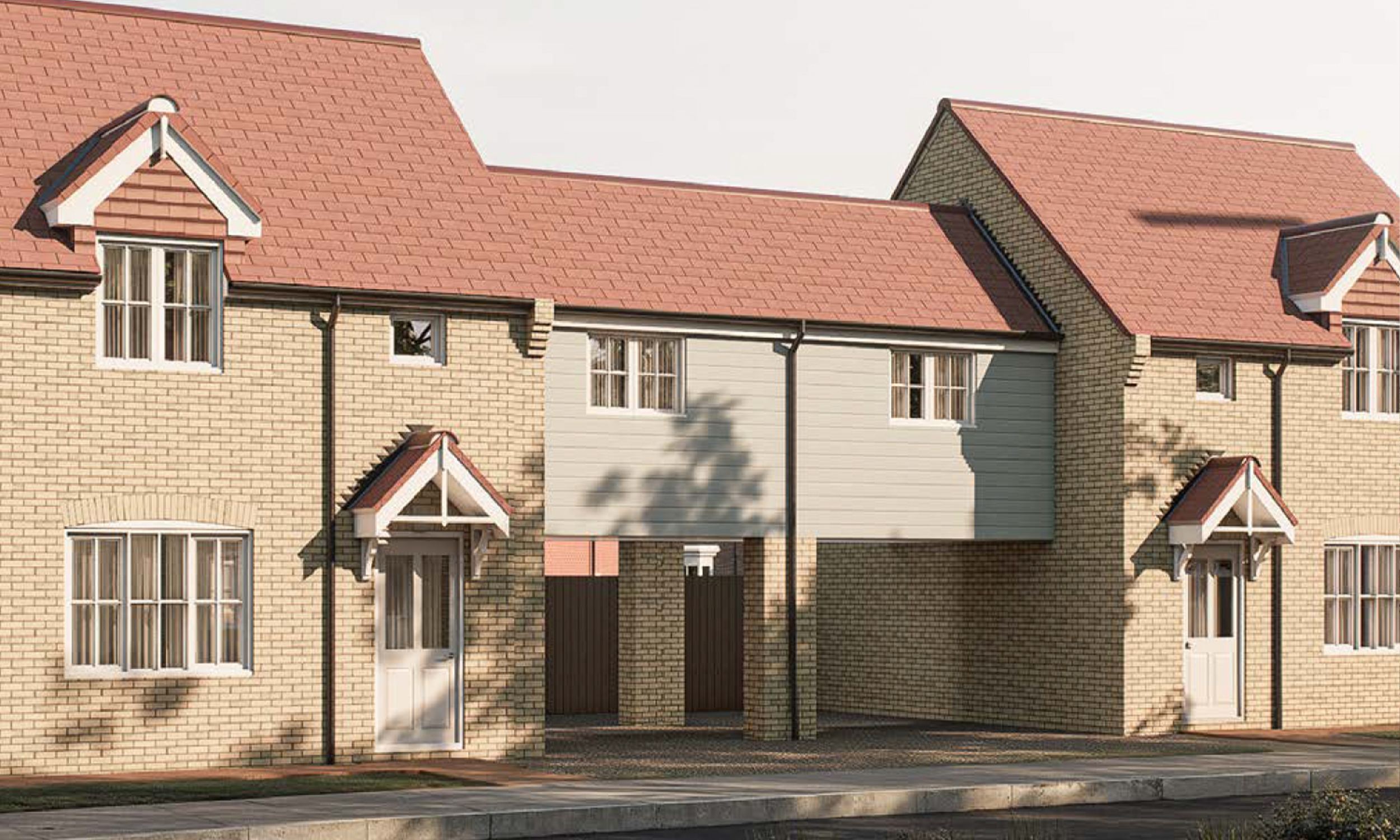 The Glenfarg — a charming soft-brick home with red tiled roof and white-framed windows, featuring a distinctive coach house archway — designed with balance and character at Gleneagles Drive.