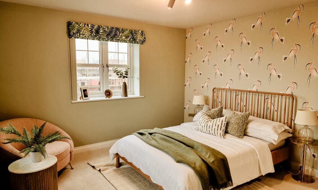 Contemporary bedroom with nature-inspired wallpaper and a relaxed neutral palette - designed for comfort and individuality at The Furlongs.