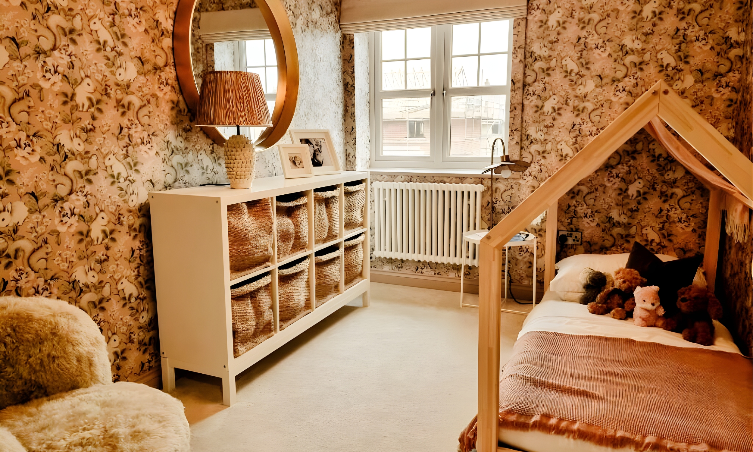 A cosy children’s bedroom with soft toys and patterned wallpaper, capturing the warmth and character of family living at The Furlongs, Holland Park.