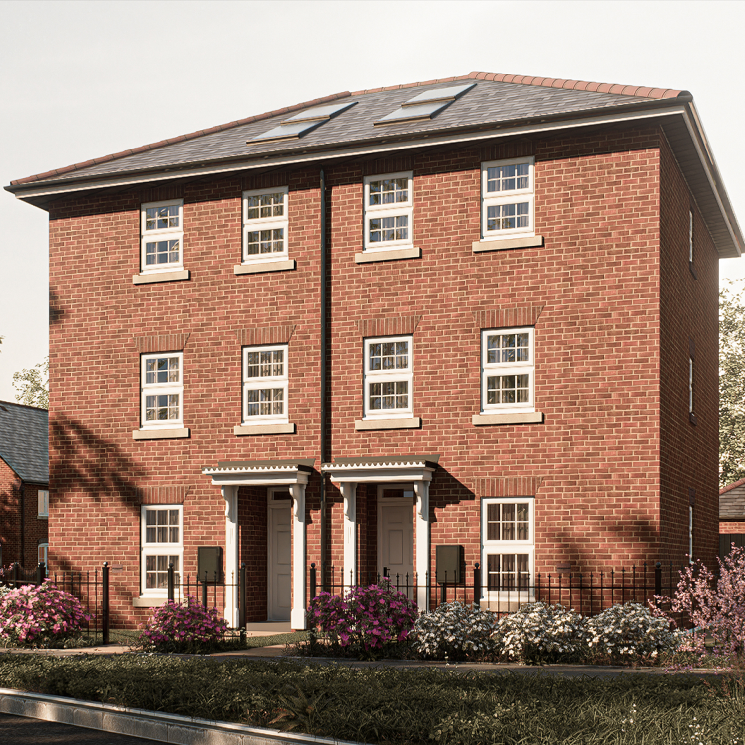 The Kenmore — a striking three-storey red-brick townhouse with decorative stone detailing and twin entrance porches, offering spacious family living at The Furlongs, Holland Park.