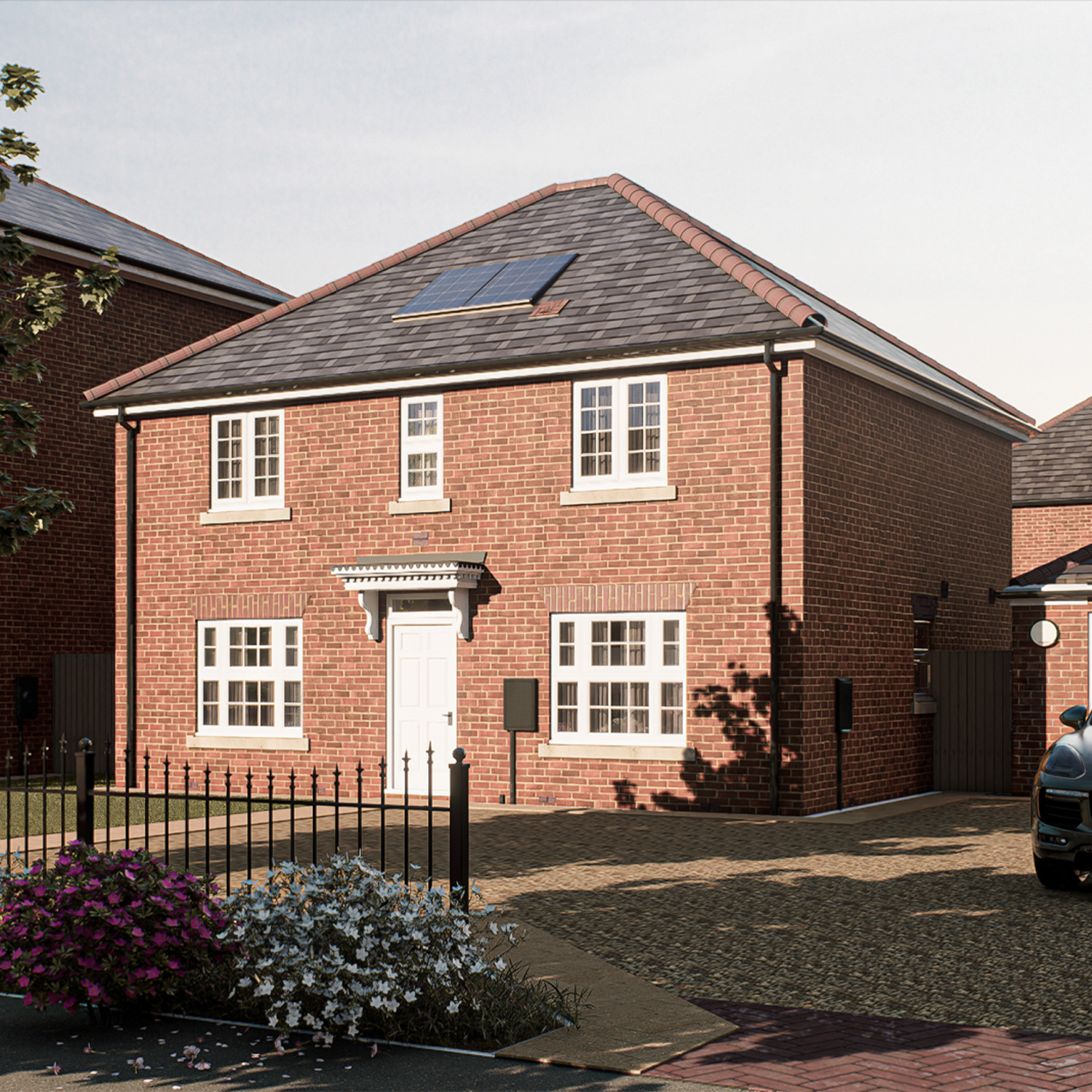 The Strathearn — a well-proportioned detached home with red-brick elevations, symmetrical windows, and solar panels, showcasing Broadgate’s thoughtful blend of tradition and innovation.