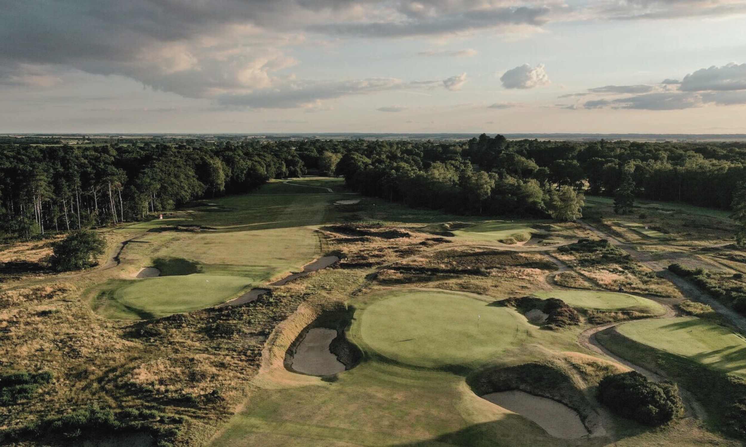 An aerial view of the world-renowned Hotchkin golf course at Woodhall Spa, with sweeping fairways, heathland and woodland edges, reflecting Lincolnshire’s natural beauty.